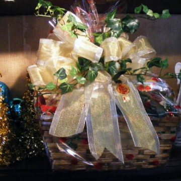 Custom holiday gift basket with gold ribbon